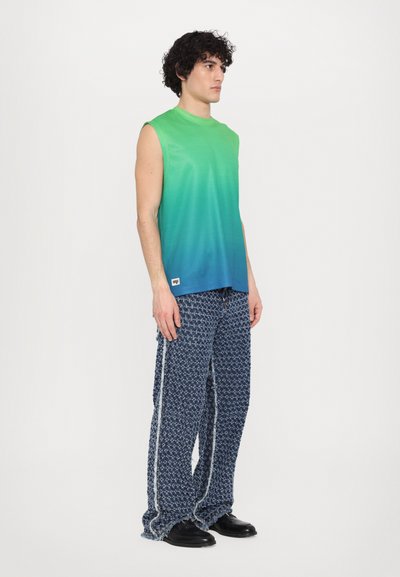 Sleeveless gradient tank top transitioning from green to blue, paired with woven navy-patterned trousers featuring a side stripe and loose fit.