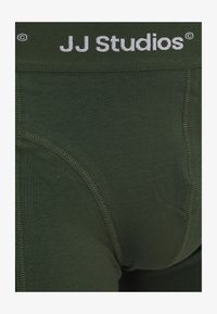 Unselected, schwarz grün lila