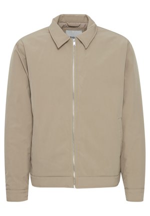 Lichtbeige ritsjack met een kraag, lange mouwen en een gladde textuur. Beschikt over zijzakken en een eenvoudig ontwerp.