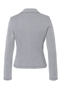 Blazer estructurado en patrón de lunares en blanco y negro, de mangas largas, con cuello de pico, corte entallado, tejido suave, detalle en la costura trasera.