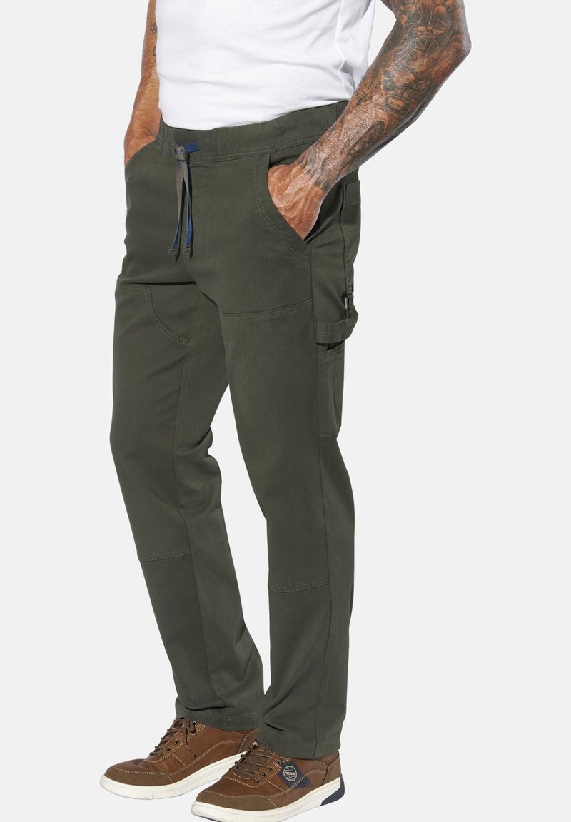 Olive green cargo pants feature a relaxed fit, elastic waistband with drawstrings, and multiple pockets. Material appears durable with smooth texture.