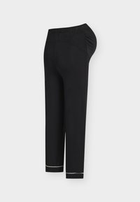 Pantalon de maternité noir avec ceinture élastique et jambes fuselées avec bandes réfléchissantes près des chevilles, présenté sur un fond uni.