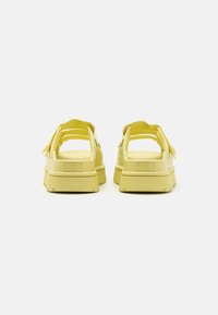 UGG GOLDENGLOW SLIDE - Heeled mules - light green