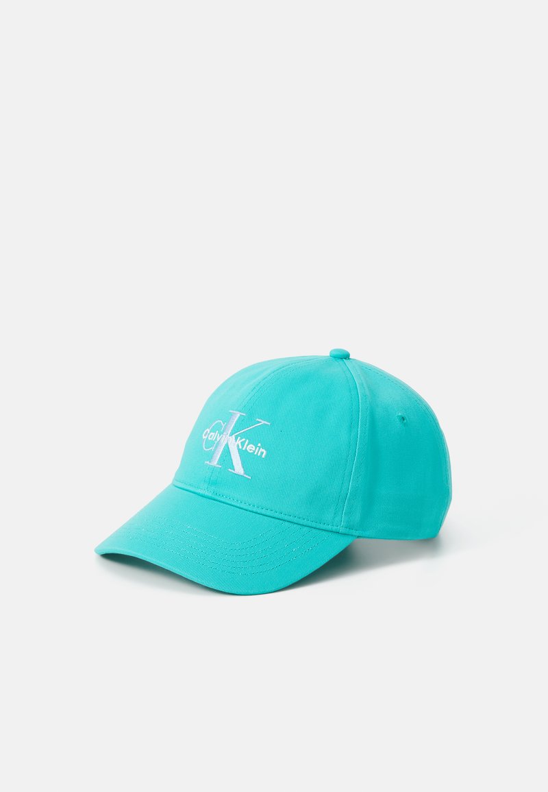 Turquoise baseball cap made of cotton-blend material, featuring a curved brim and white embroidered logo "Calvin Klein" with a prominent "K."