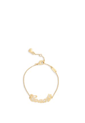 Gold-tone bracelet featuring a script “Coach” logo, delicate chain, heart-shaped accents, and a lobster clasp for closure.