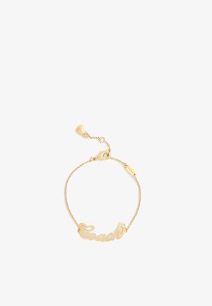 Pulsera de tono dorado con un logotipo en script "Coach", cadena delicada, acentos en forma de corazón y un cierre de langosta.