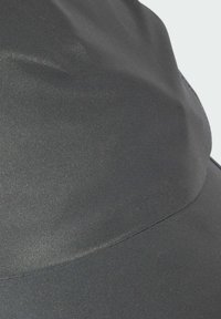 Black hat with a smooth, shiny fabric surface, featuring a rounded crown and a wide, curved brim. Seam detail visible along the edge.