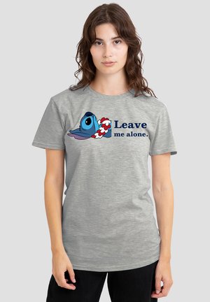 Gray cotton t-shirt featuring a cartoon character's head and the text "Leave me alone." The design includes bold blue, red, and white accents.