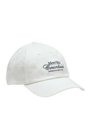 White cotton baseball cap with a rounded crown, curved brim, and embroidered text in blue: "Meet You Courtside lululemon Est. 1998."