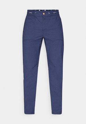 Pantaloni blu navy realizzati in tessuto leggero, con vita elastica, due tasche frontali e un logo discreto vicino al ginocchio.