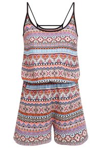 Färgglad mönstrad romper med tunna svarta remmar, med geometriska mönster i rosa, blått, rött och vitt på ett lätt material.