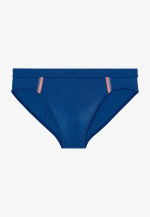 Blå svømmebukser lavet af glat materiale, med et lavtaljet design og subtile stribede detaljer på siden for ekstra stil.