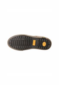 Sneaker-Boden aus schwarzem Gummi mit tiefen, kantigen Profilen. Verfügt über ein gelbes, kreisförmiges Logo und eine strukturierten hellbraunen Zwischensohle.