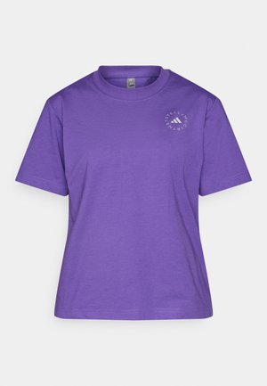 Violetti puuvillapaita, jossa on pyöreä kaula-aukko, lyhyet hihat ja pyöreä logo design vasemmalla puolella rintaa.