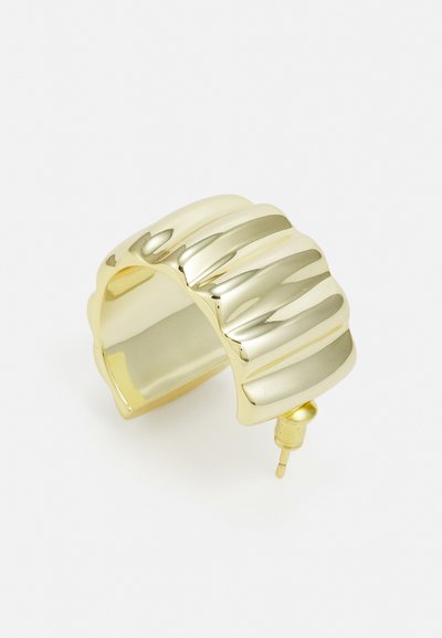 Gold-toned hoop earring with a textured wavy design, polished finish, and a stud fastening at the base for secure wear.