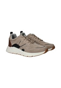 Sneakers in suede beige con accenti neri, suola in gomma e design con lacci. Presentano un interno imbottito e tallone imbottito per il massimo comfort.