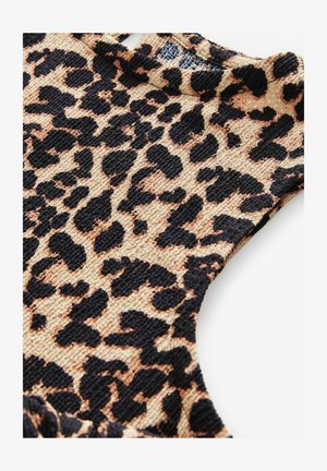 Leopardenmusterstoff mit strukturierter Oberfläche, der schwarze und beige Muster zeigt. Der Ausschnitt ist rund mit durchbrochener Detailgestaltung.