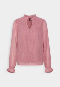 Blouse rose à manches longues avec motif à pois texturé, col à volants, encolure fendue et poignets à volants.