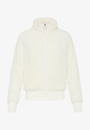 Valkoinen pehmeä vetoketjullinen takki korkealla kauluksella, ribbatut hihat ja pehmeä, tekstuuriainen kangas. Edessä on vetoketju sulkemista varten.