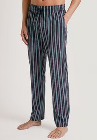 Marineblauwe gestreepte pyjamabroek met een drawstring taille, met witte en lichtblauwe verticale strepen en zijzakken.