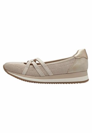 Beige strik slip-on sko med krydsede elastikstropper, polstret sål og gummiydersål til afslappet brug.