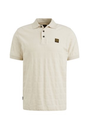 Polo shirt beige realizzato in tessuto texturizzato. Presenta una patta con due bottoni e un piccolo logo ricamato sul petto. Maniche corte.