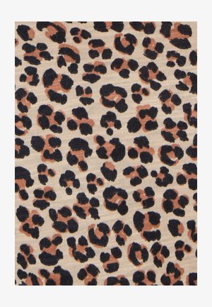 Tissu à motif léopard avec des taches irrégulières noires et marron sur un fond beige clair, présentant une texture douce.