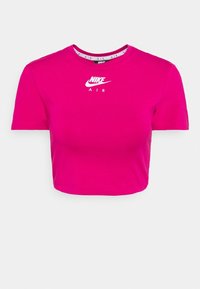 Kraftigt beskuren kortärmad T-shirt i klar rosa bomull. Har en vit Nike Air-logotyp i mitten, rund hals och en slät yta.