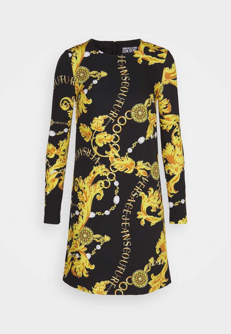 Abito nero a maniche lunghe con audace motivo barocco giallo, caratterizzato da disegni intricati e testo, realizzato in un tessuto morbido ed elastico.