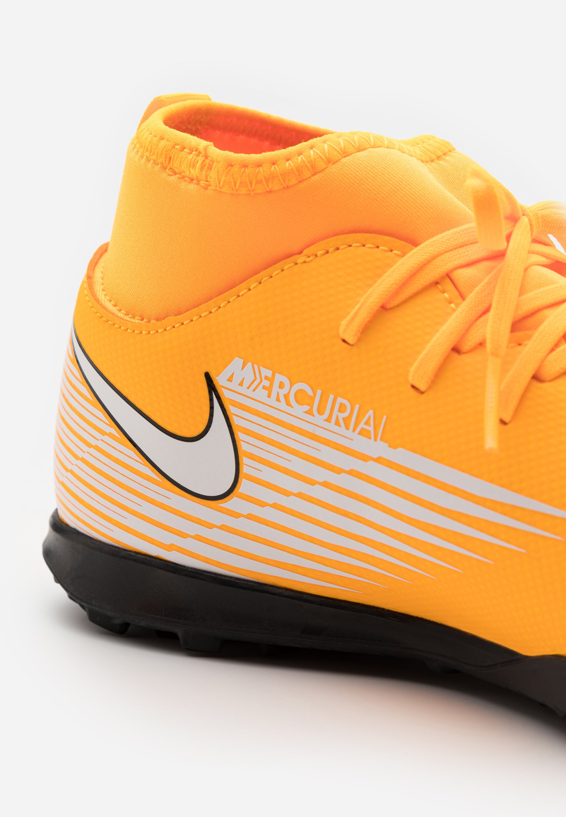 black and orange turf shoes
