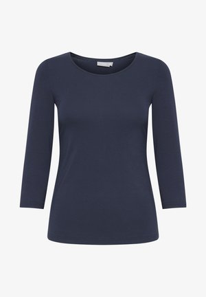 Námořnické tričko s dlouhým rukávem vyrobené z jemné tkaniny, s kulatým výstřihem a přiléhavým střihem. Hladká textura bez viditelných vzorů nebo akcentů.