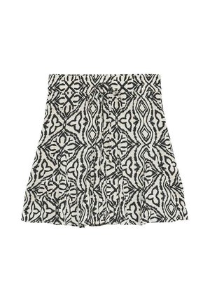 Jupe noire et blanche à motifs, longueur genou, avec des dessins géométriques abstraits et un détail nœud à l'avant à la taille.