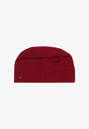Red fleece winter hat with a folded brim and small round silver logo detail on the bottom left side.