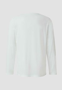 Langärmeliges Shirt mit Rundhalsausschnitt aus weißer Baumwolle. Glatte Textur, schlichtes Design, ungeschmückter Rücken mit geradem Saum.