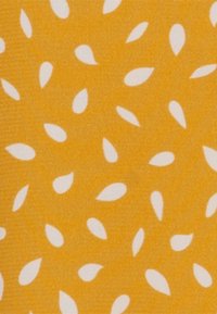 Yellow fabric with a smooth texture, featuring scattered white teardrop shapes in a repeating pattern.