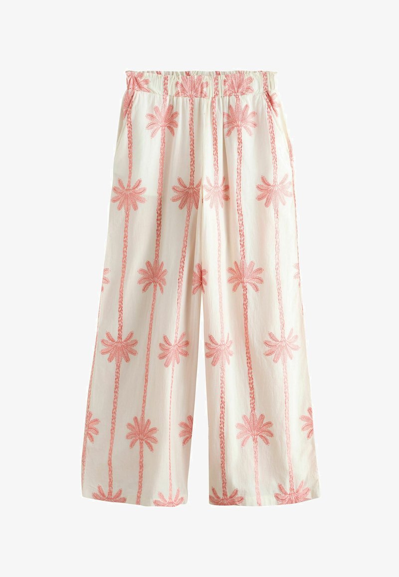 Losse witte broek met roze verticale palmboomprints en een elastische tailleband.