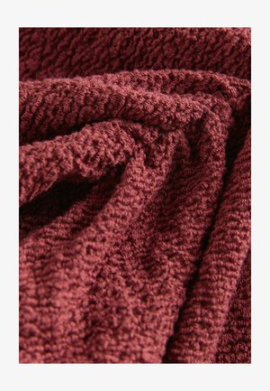 Textured, deep burgundy fabric with a soft, nubby surface, displaying a sturdy weave and wrinkled folds.