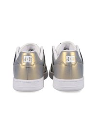 Men's sneakers featuring a metallic gold and black design, with white soles and branding on the heel, textured material, and padded collar.