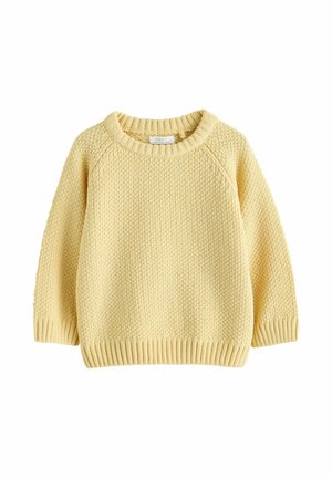 Geltonas megztinis su apvalia iškirpte, raglaninėmis rankovėmis ir iškirptais rankogaliais bei apačia. Tekstūruotas raštas visame audinyje.