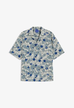 Short-sleeve shirt in light beige with blue floral pattern. Features a classic collar and button-down front. Lightweight fabric with a soft texture.