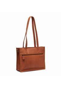 Borsa a mano in pelle marrone con due manici lunghi, dotata di una tasca frontale con zip e una superficie liscia. Forma rettangolare con cuciture minime.