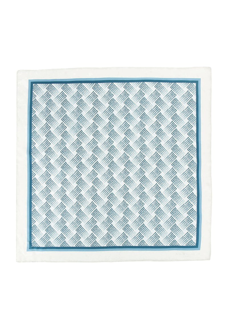 Tovaglietta bianca con un design geometrico blu, bordata da un bordo blu solido. Realizzata in tessuto con una superficie testurizzata.