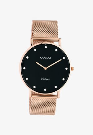 Montre à bracelet en maille rose doré avec cadran noir, index heures en cristal et aiguilles dorées indiquant 10 h 10, marque OOZOO Vintage.