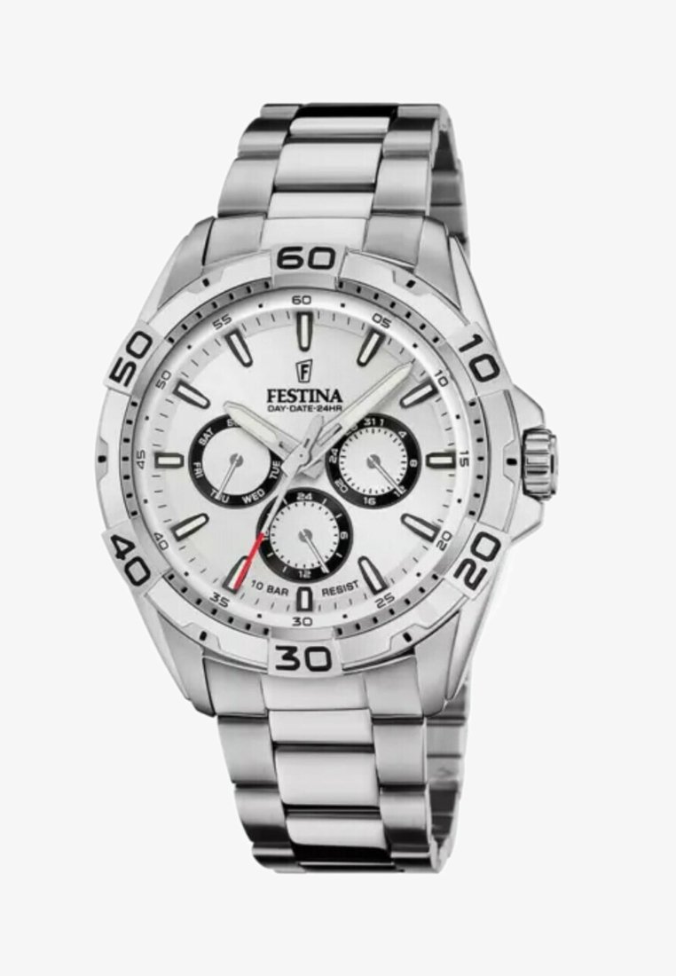 Sudraba nerūsējošā tērauda pulkstenis ar baltu ciparnīcu, melniem subdialiem un datuma rādītāju. Iekļautas luminescentas stunda atzīmes un takimetra bezele.