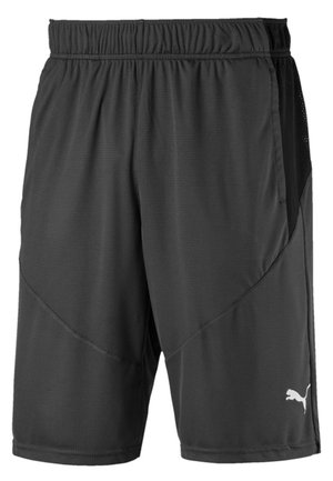 Zwarte sportshorts van synthetische stof met een zijpaneel van mesh, een elastische tailleband en een klein wit logo aan de rechteronderkant.