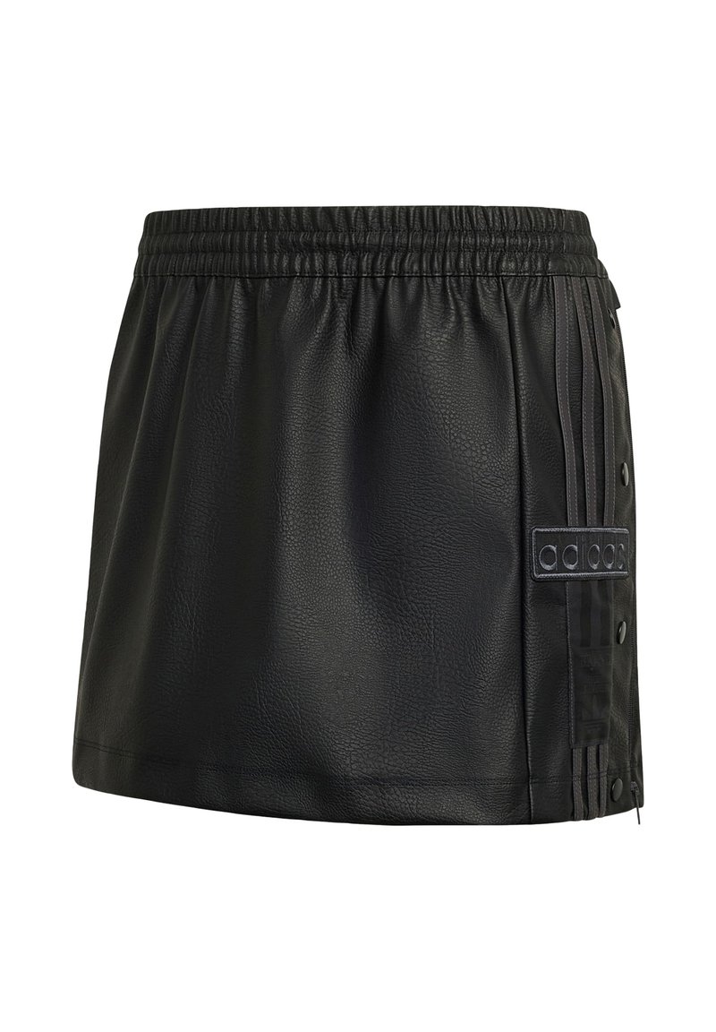 Black faux leather mini skirt with elastic waistband, side snap buttons, and Adidas logo patch on striped panel.