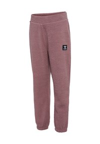 Fleece joggers in mauve with an elastic waistband, tapered leg, and small black logo patch on the left thigh. Soft, textured fabric.