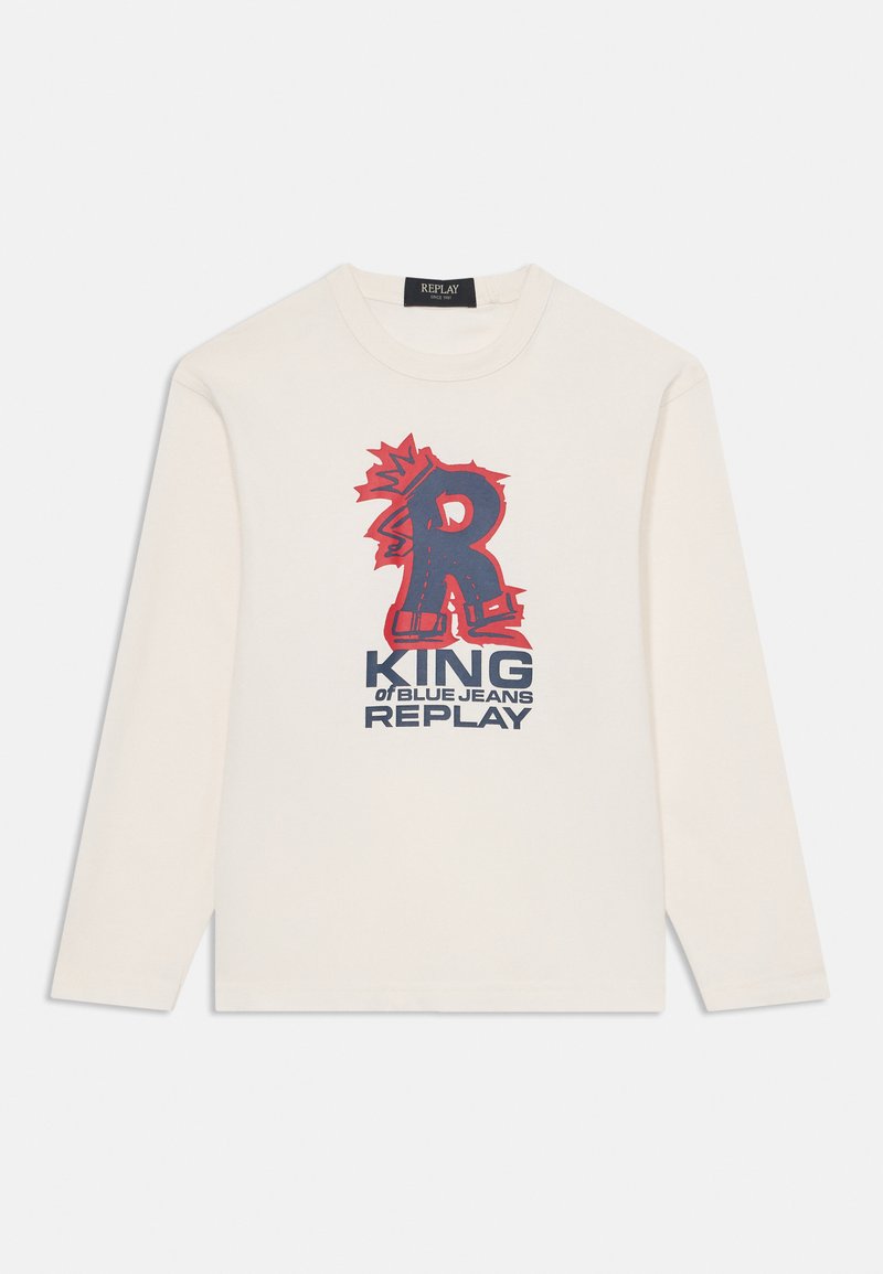 Pitkähihaisen kermaisen puuvillapaidan etuosassa on rohkea punainen ja laivastonsininen graafinen kuvio, jossa lukee "KING of BLUE JEANS REPLAY" sekä tyylitelty kirjain "R."