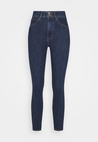 Jeans ajustados de color azul oscuro con cintura alta, que cuentan con cinco bolsillos, costuras en contraste y un cierre de dos botones. Textura de denim suave.