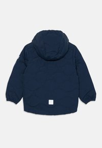 Navy blue quilted jacket with hood, long sleeves, elastic cuffs, and a small white logo patch on the lower back.